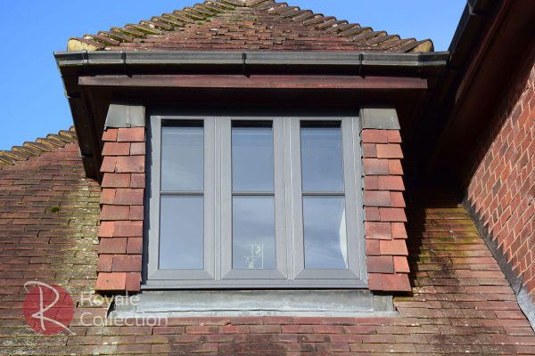 MB Frames Deceuninck uPVC Windows Grey colour on a red brick home upper floor